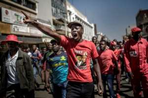Several hundred opposition Movement for Democratic Change (MDC) supporters gathered outside the party headquarters in Harare, chanting and shouting that they had won the elections. By Luis TATO (AFP)