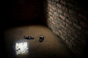 Shoes float in what was once a living room of a house in Bangui. By FLORENT VERGNES (AFP)