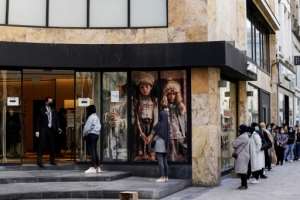 Shoppers in Belgium eagerly waited to get back into shops. By Kenzo TRIBOUILLARD (AFP)