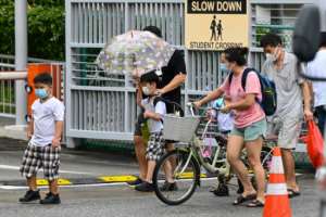 Singapore has tightened restrictions because of a fresh outbreak, including the closure of schools. By Roslan RAHMAN (AFP)