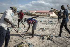 Sisyphus: Young people spent several days last month cleaning up the beach -- little more than a week later, it was covered once more with trash. By JOHN WESSELS (AFP)