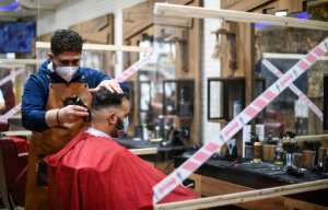 Some Germans were delighted to finally return to salons. By Ina FASSBENDER (AFP)