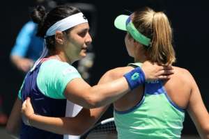 Sofia Kenin (R) defeated Ons Jabeur 6-4, 6-4 and now faces top seed Ashleigh Barty or Czech seventh seed Petra Kvitova in the last four in Melbourne. By DAVID GRAY (AFP)