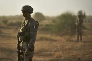 Soldiers from the French Army in the Sahel monitor a rural area in northern Burkina Faso in November 2019. By MICHELE CATTANI (AFP/File)