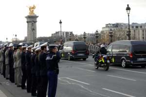 Soldiers saluted as the funeral convoy passed by and hundreds lined the streets. By GEOFFROY VAN DER HASSELT (AFP)