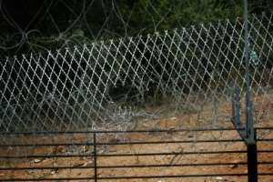 South Africa says it will fix the damaged fence at its Beit Bridge border post with Zimbabwe to help prevent the spread of coronavirus. By GIANLUIGI GUERCIA (AFP/File)