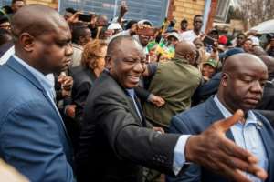 South African President Cyril Ramaphosa greeted voters before casting his ballot at a primary school in Soweto. By Michele Spatari (AFP)