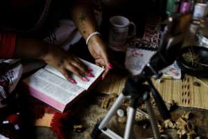 South African sangomas offer services including dream interpretations using tools like the Bible. By Guillem Sartorio (AFP)