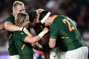South Africa's Makazole Mapimpi (C) is congratulated by teammates after scoring a try during the Japan 2019 Rugby World Cup final against England. By Anne-Christine POUJOULAT (AFP)