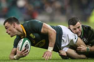 South Africa's centre Jesse Kriel (L) is tackled by Ireland's centre Robbie Henshaw during their rugby union Test match, at the Aviva Stadium in Dublin, on November 11, 2017