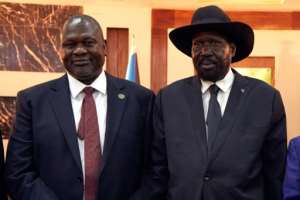 South Sudanese President Salva Kiir (right) pictured in February 2020 with his one-time rival turned deputy Riek Machar. By ALEX MCBRIDE (AFP/File)