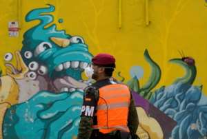Spain reported a sharp drop in its daily virus death toll on Sunday. By JOSE JORDAN (AFP)