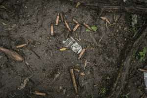 Spent bullet casings litter the ground near a mass grave in Chenna. By Amanuel Sileshi (AFP)