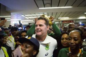 Springboks coach Rassie Erasmus (C) surrounded by Springbok supporters at OR Tambo airport near Johannesburg this week after arriving from Japan. By Guillem Sartorio (AFP)