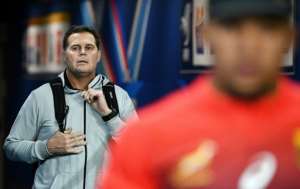 Springboks coach Rassie Erasmus (L) arrives for a training session before a Test in France last year. By FRANCK FIFE (AFP)