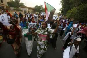 Sudanese women - who played a key role in the protest movement - march through the streets of the capital at the end of May. By ASHRAF SHAZLY (AFP / File)