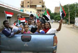 Sudanese children take part in celebrations after protest leaders and generals signed a landmark agreement that will govern Sudan's three-year transition to civilian rule. By Ebrahim HAMID (AFP)