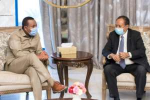 Sudanese Prime Minister Abdalla Hamdok (R) met his Ethiopian counterpart Abiy Ahmed in Khartoum. By Handout (Sudan's Foreign Media Council/AFP)