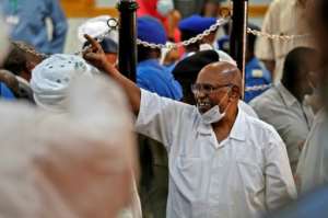 Sudan's ousted president Omar al-Bashir is pictured during his trial in the capital Khartoum on December 15, 2020, along with others over the 1989 military coup that brought him to power. By ASHRAF SHAZLY (AFP/File)