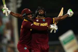 Sudden impact: Carlos Brathwaite celebrates West Indies' 2016 T20 World Cup final win with teammate Marlon Samuels. By DIBYANGSHU SARKAR (AFP/File)