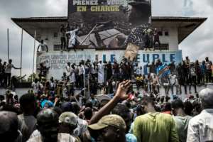 Supporters of Felix Tshisekedi, who was named provisional winner of Democratic Republic of Congo's presidential election, celebrate outside the Union for Democracy and Social Progress (UDPS) headquarters in Kinshasa on January 10, 2019. By John WESSELS (AFP/File)