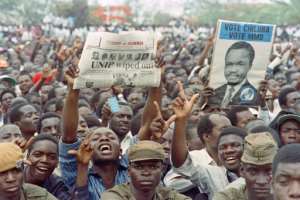 Supporters of Frederick Chiluba cheer his presidential inauguration in 1991, the first of two terms he would serve as Zambia's president. By Walter DHLADHLA (AFP/File)