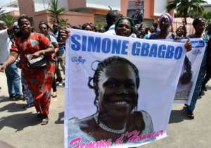 Supporters of Simone Gbagbo celebrated in front of her home in the upmarket district of Cocody. The former first lady and her husband, Laurent, retain enthusiastic support among part of the electorate. By ISSOUF SANOGO (AFP)