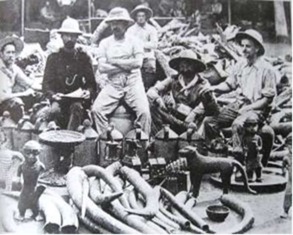 British soldiers of the infamous Punitive Expedition of 1897 proudly posing with the looted Benin artefacts.