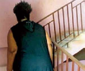 A student returning to the hall with her luggage