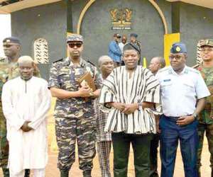 The Minister in smock and members of the regional security council
