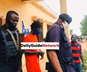 Accused person Latifah Bumaye being escorted by police at Bole District Magistrate Court