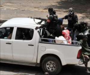 Militiamen loyal to Laurent Gbagbo have been patrolling Abidjan and setting up roadblocks