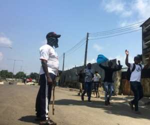 Makeshift barricades emerged in Lagos run by men in civilian clothes carrying machetes and sticks who present themselves as 