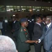President Mills arrives from Switzerland
