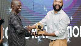 Emeka Okpara  right receiving his award.