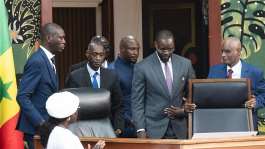 Former Senegal Prime Minister Ousmane Sonko (C) take his seat as Speaker of Senegal National Assembly on 26 May 2026, at the National Assembly in Dakar. Senegals National Assembly elected ousted prime minister Ousmane Sonko its speaker Tuesday in a vote boycotted by opposition, following months of tension that culminated last week in the firebrands sacking. - AFP - SEYLLOU