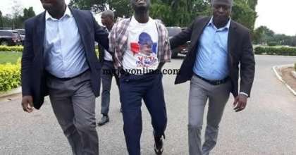Kojo Mensah (M), being taken out of Parliament