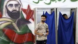 A man prepares to cast his ballot at a polling station during parliamentary elections in Algiers on July 2, 2026. -  AFP