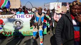 Anti-immigrant protesters march in Johannesburg, South Africa, on 9 July 2026. The country has seen a tide of demonstrations and violence against foreign residents. -  REUTERS - Oupa Nkosi
