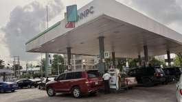 People buying fuel at a petrol station in Lagos, Nigeria, in March 2026. - AP - Sunday Alamba