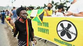 People calling for slavery reparations protest outside the British High Commission during a visit by the Duke and Duchess of Cambridge in Kingston, Jamaica, on 22 March 2022. - AFP - RICARDO MAKYN