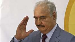 Libyas eastern military chief Khalifa Haftar waves after a speech at the local headquarters of the High National Election Commission in Benghazi on November 16, 2021. -  Abdullah Doma, AFP