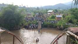 This photo, taken by a local, shows the bridge that once connected the two parts of the village of Hombo after it collapsed on June 3, 2026. Even though a number of people - including children - fell into the water, no one died. -  Observers