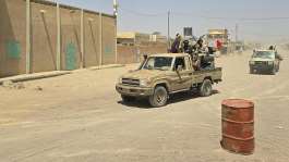 Tuareg rebels from the Azawad Liberation Front (FLA) coalition ride in the back of a pick-up truck in Kidal, Mali, on 26 April 2026. -  AFP