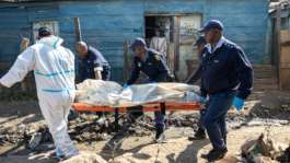 The attackers struck before midnight on Tuesday in an impoverished area of metal shacks near where illegal miners were living and working.  By EMMANUEL CROSET (AFP)