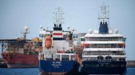 The MV Hondius is refuelled by a tanker off Tenerife on May 11, 2026.  By JORGE GUERRERO (AFP)