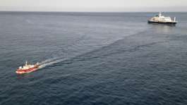 Two crew members and one other person thought to be infected were taken off the ship.  By - (AFP)