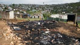 Two Mozambican nationals were killed and several houses torched after a march against undocumented foreign nationals.  By RODGER BOSCH (AFP)