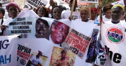 Wearing T-shirts that read #justicemustprevail, the protesters held photographs of people killed during Jammeh's rule. By ROMAIN CHANSON (AFP)