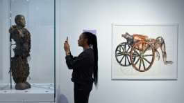 A statue stolen from a Congolose chief stands in the museum as A Symbol of Stolen Art as part of an exhibition highlighting the colonial-era plunder.  By JOHN THYS AFP